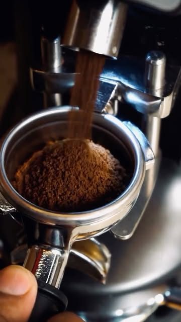 Fresh coffee being ground into a portafilter